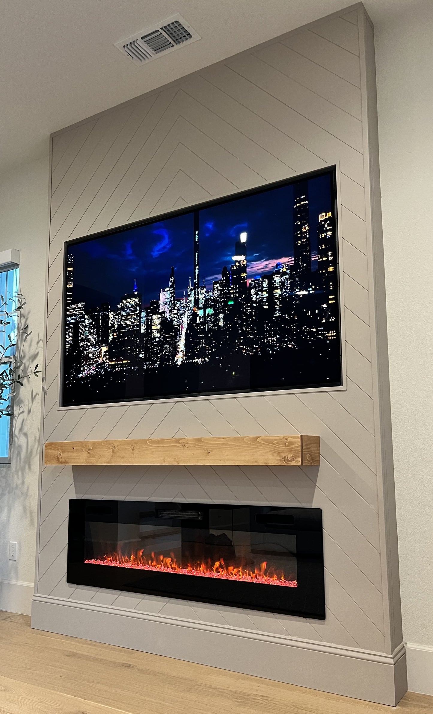 Minimalist media wall with integrated fire feature