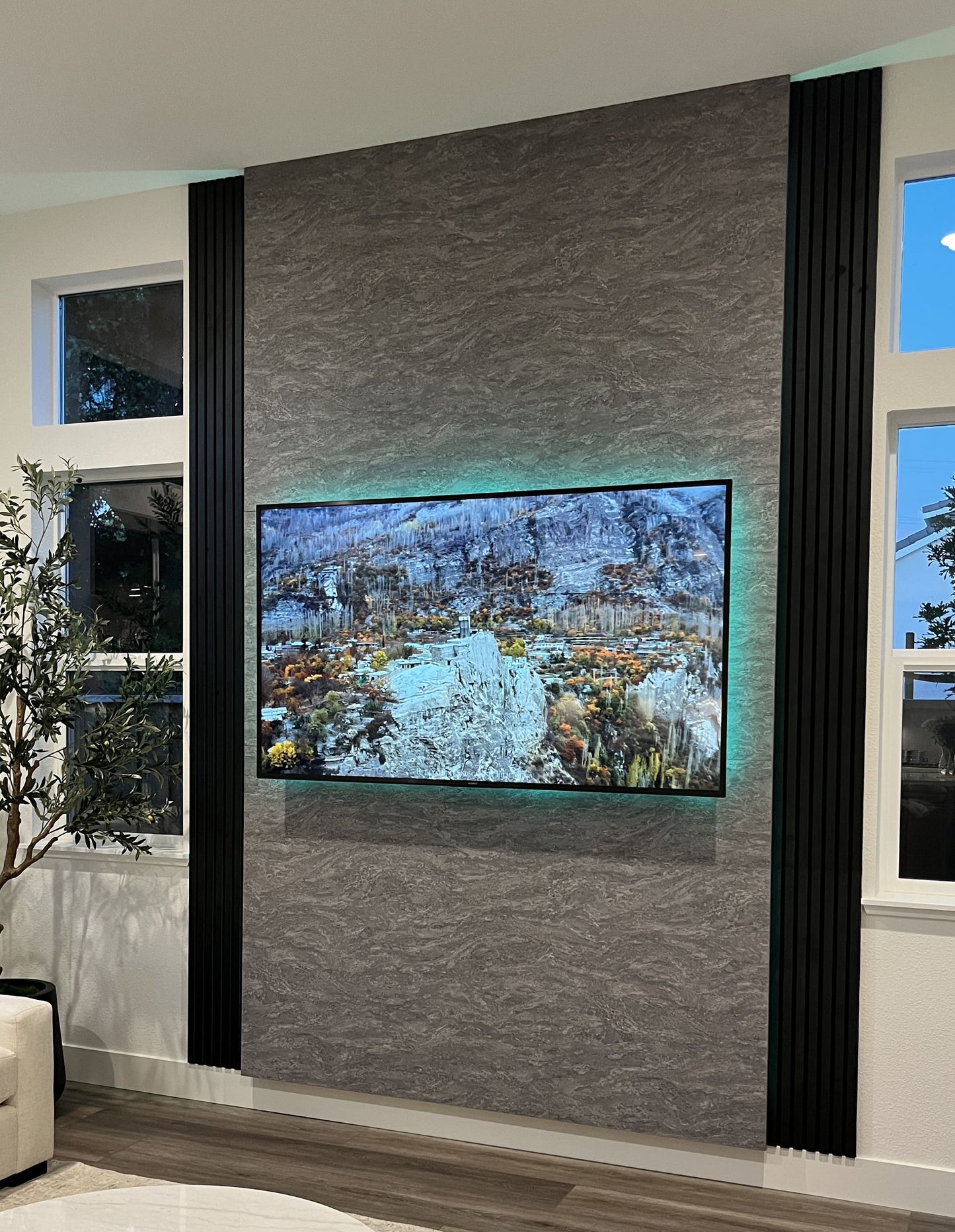 Marble-effect cabinetry and custom media wall