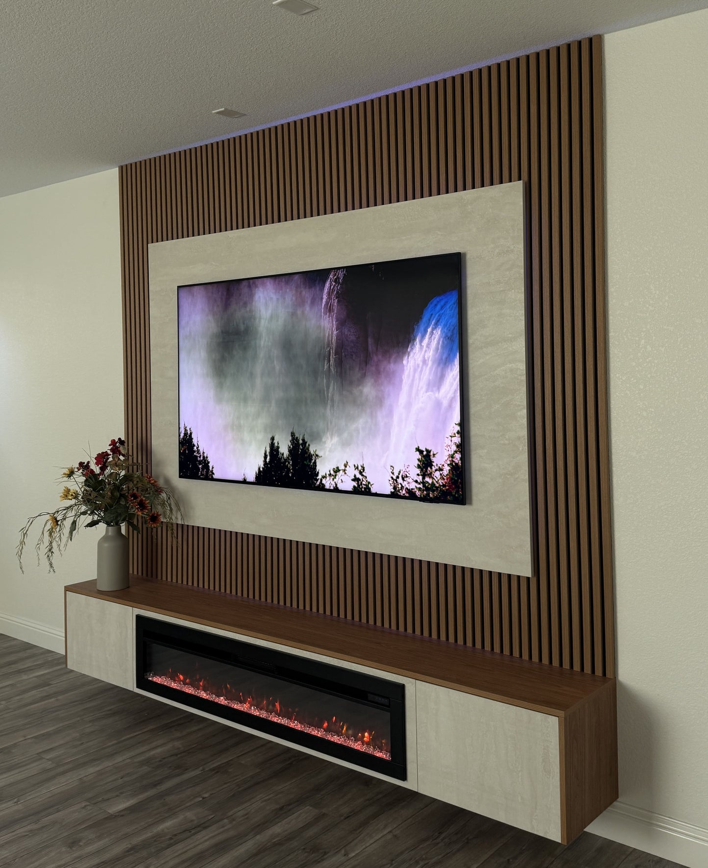 Wood-finish cabinets and custom entertainment wall