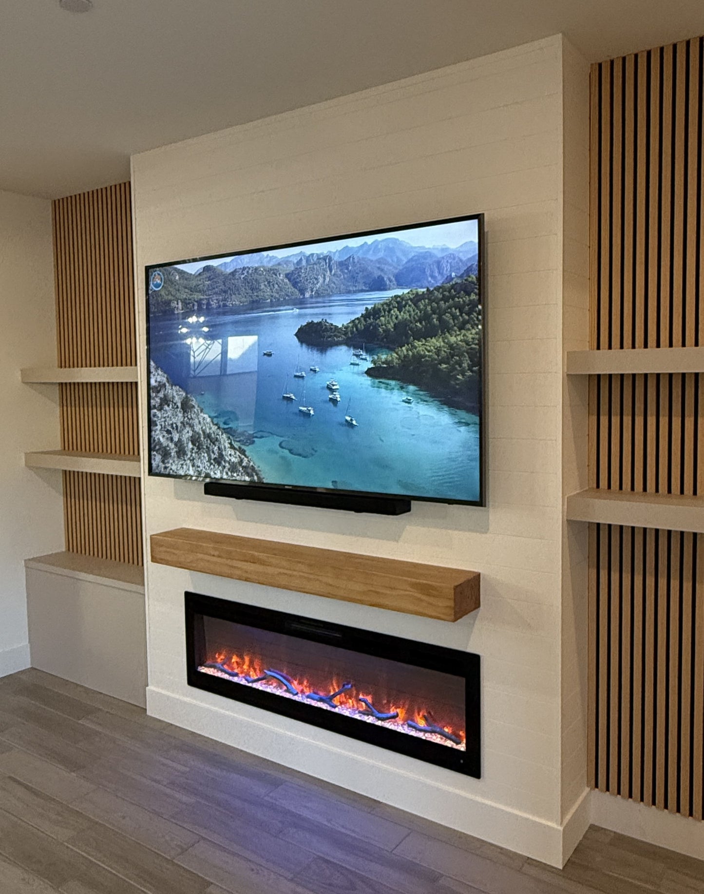 Elegant bespoke cabinets with entertainment wall