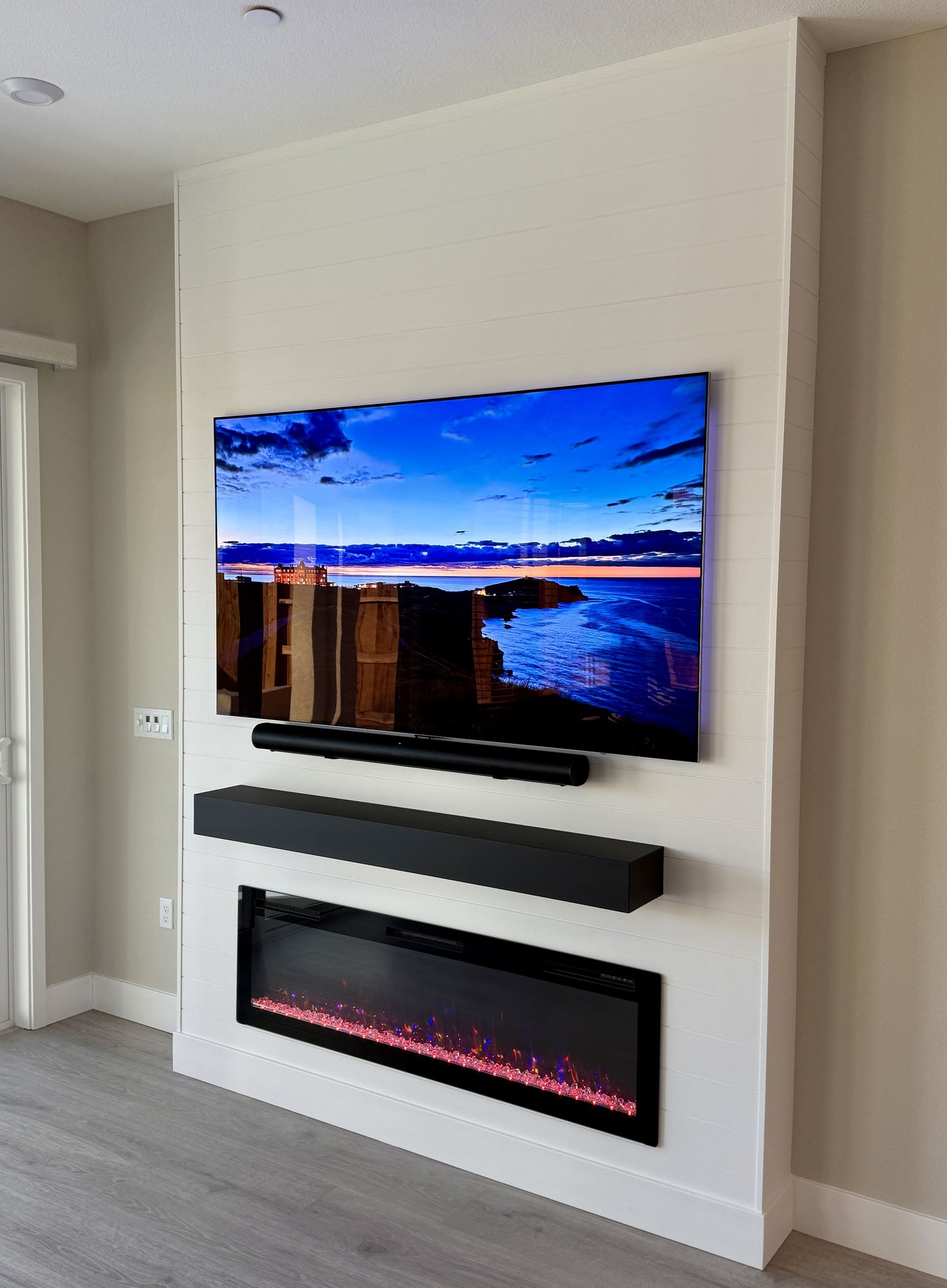Custom media wall with integrated electric fireplace