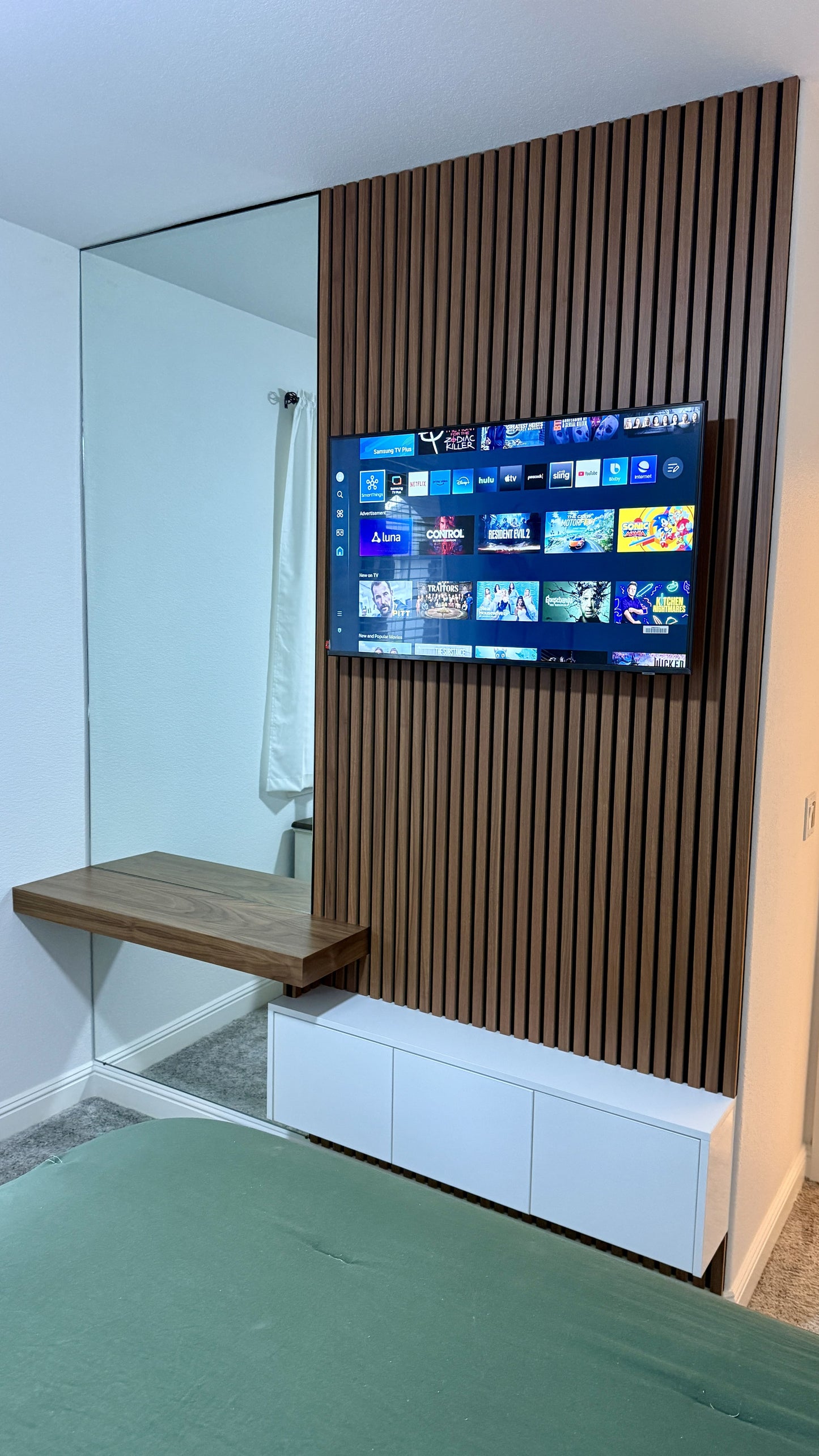 Custom media wall with built-in cabinetry and mounted TV