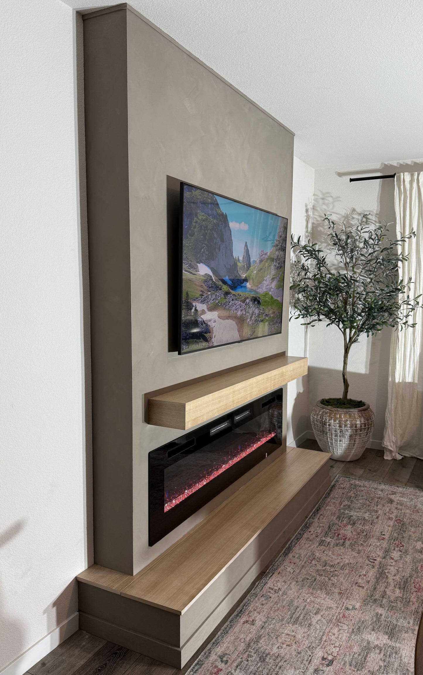 Custom media wall installation with floating cabinets