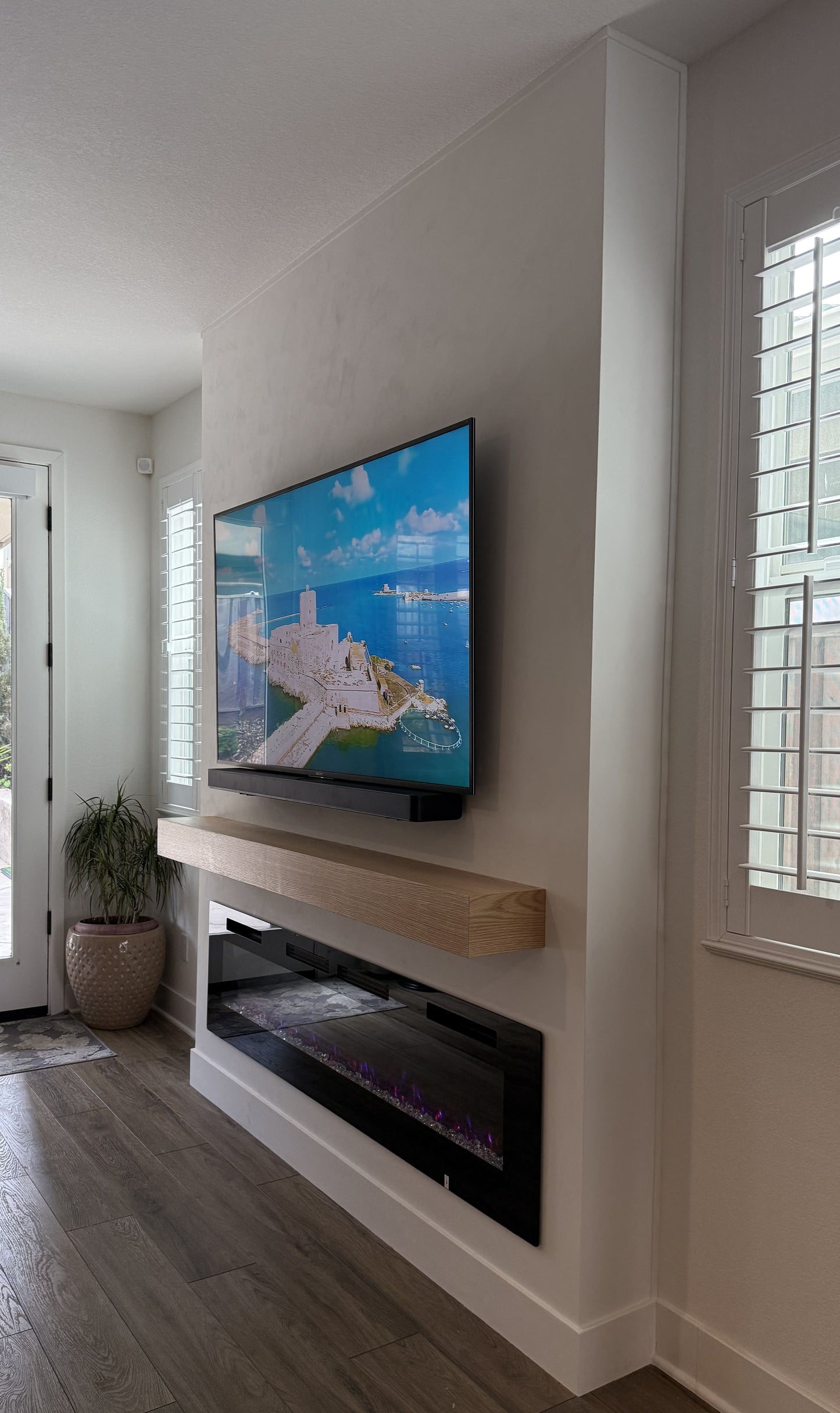 Ultra-modern TV feature wall with matte surfaces