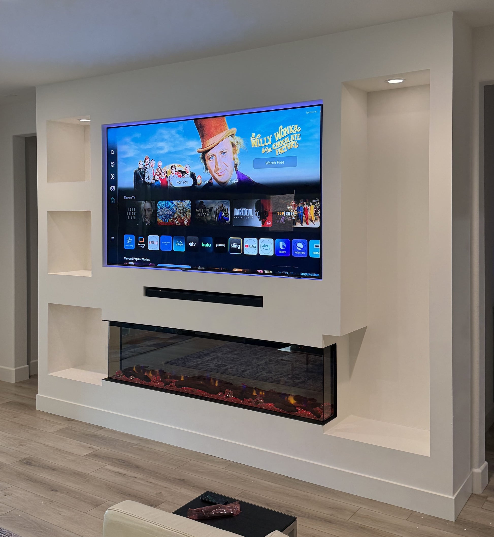 Custom cabinetry with LED-lit media wall