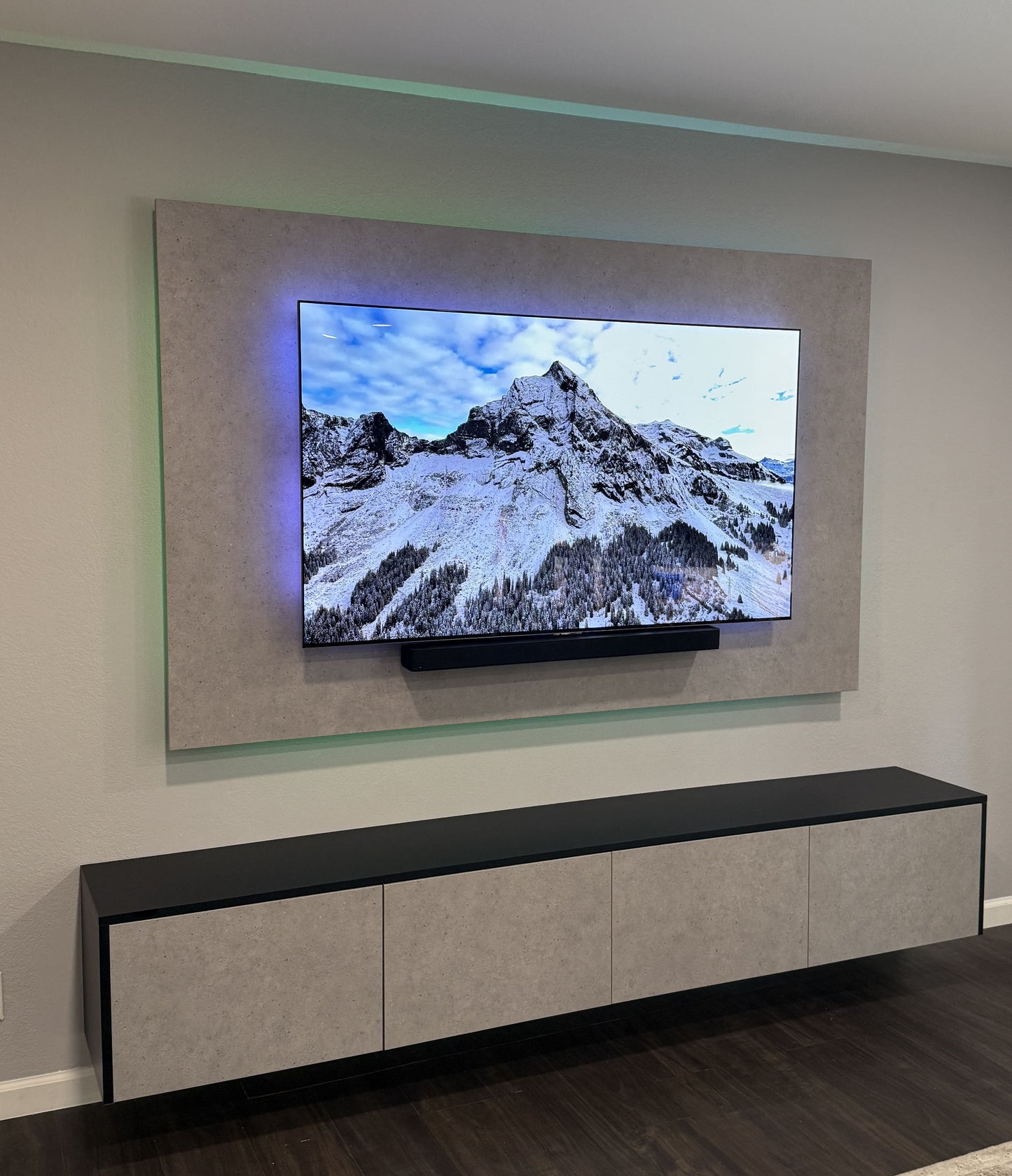 High-gloss white cabinetry with TV media wall