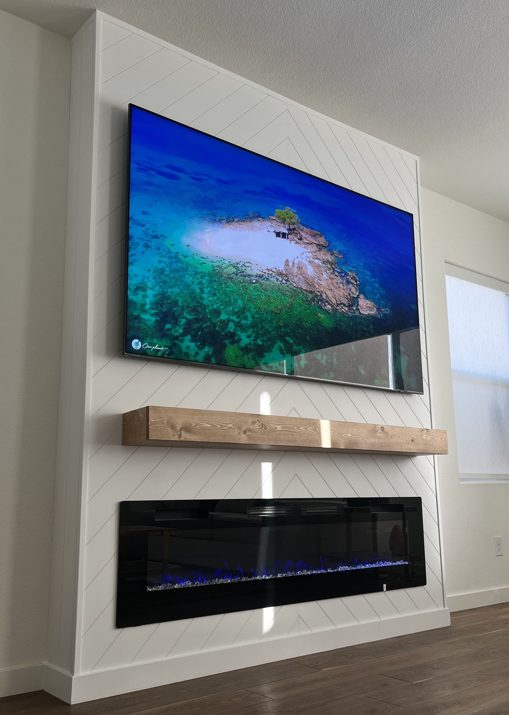 Bespoke entertainment wall with fireplace centerpiece