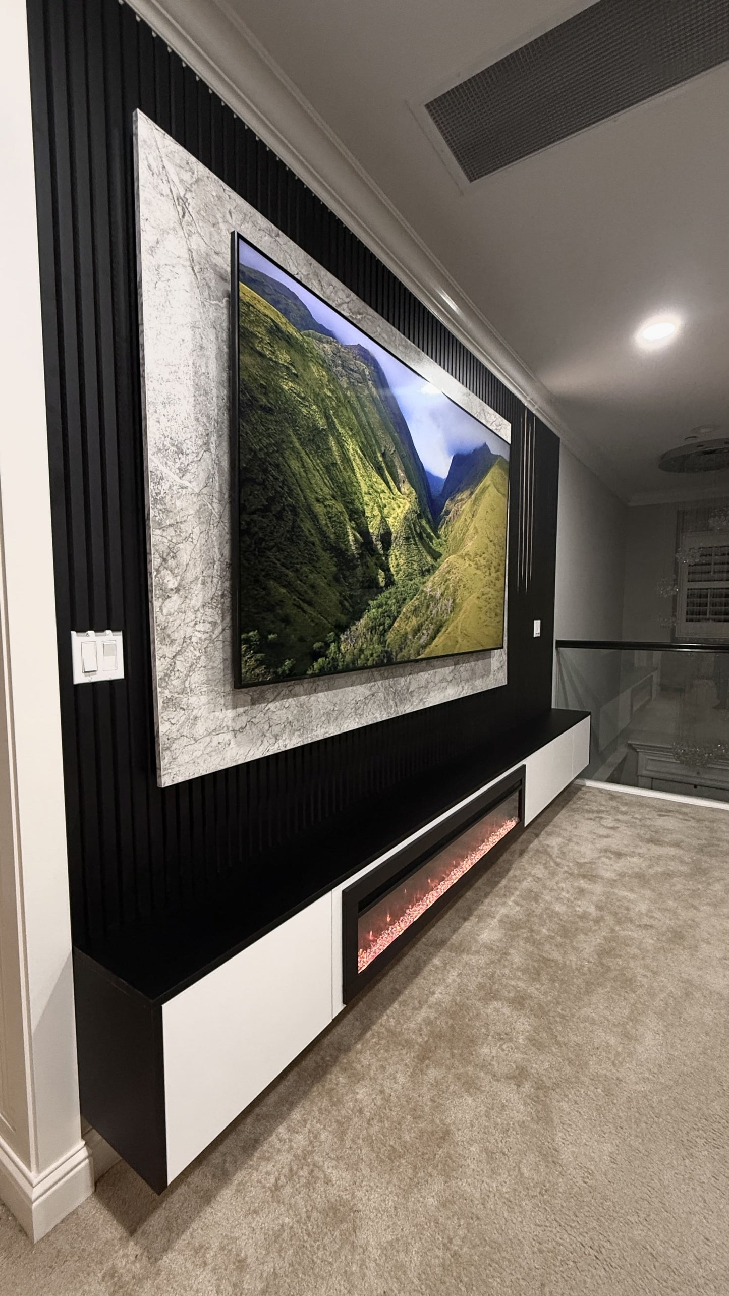 Custom media wall with fireplace and cabinetry
