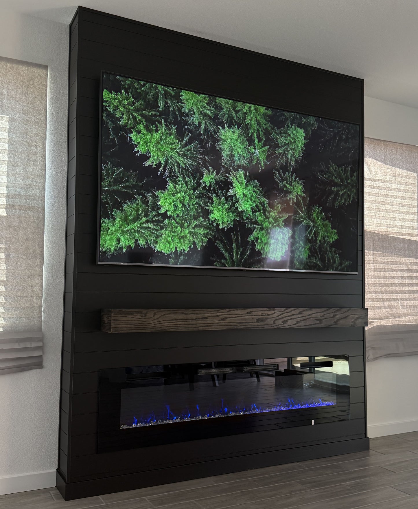 Custom media wall with hidden storage compartments
