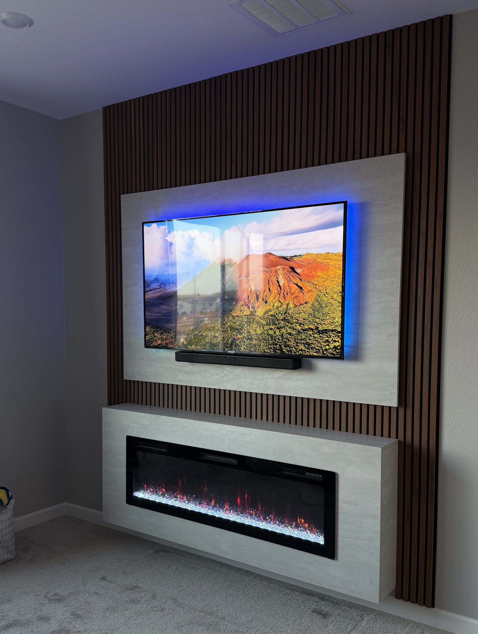 Custom oak wood media wall with mounted TV