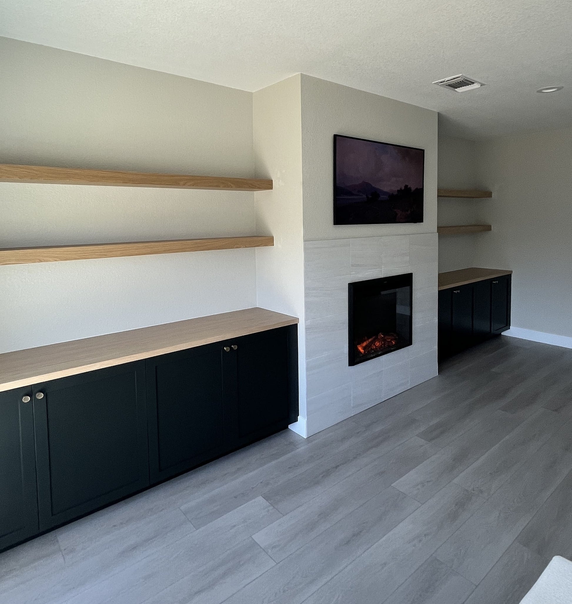 Luxury cabinetry with integrated TV and fireplace