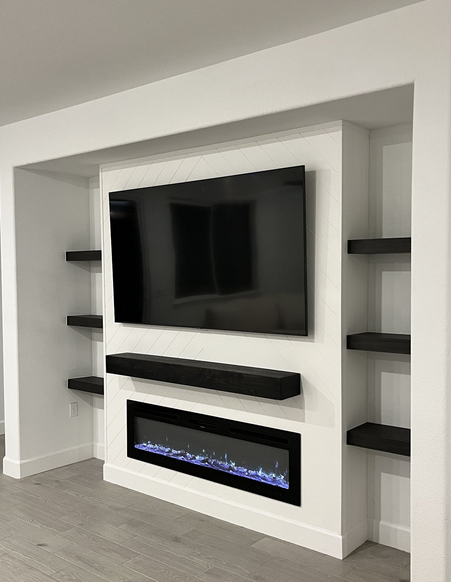 Modern TV wall with illuminated cabinets