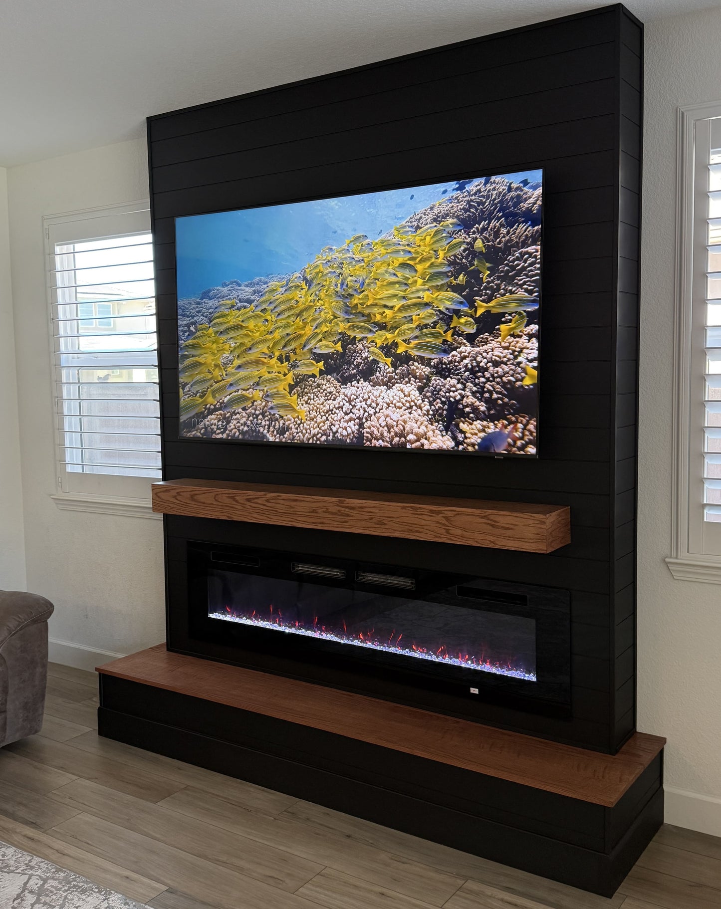 Stone-texture media wall with integrated television