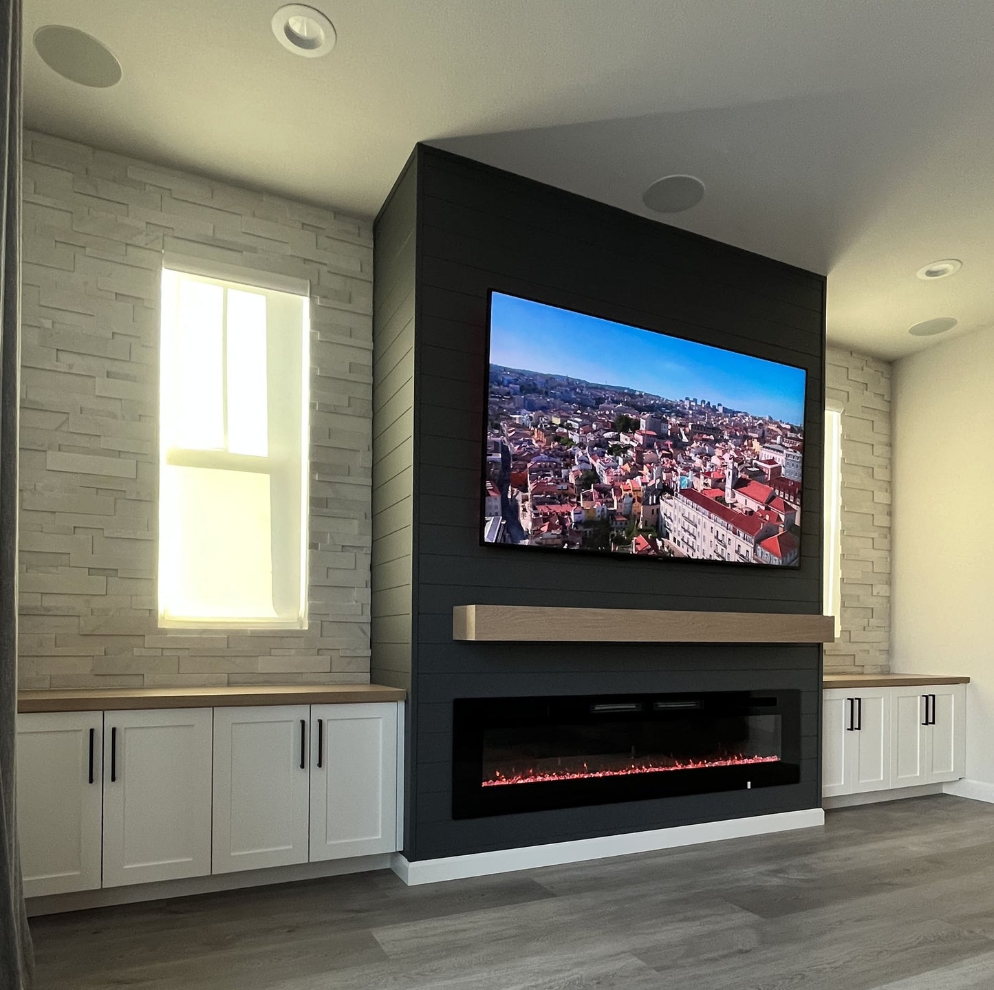 Bespoke entertainment wall with cabinets and fire feature