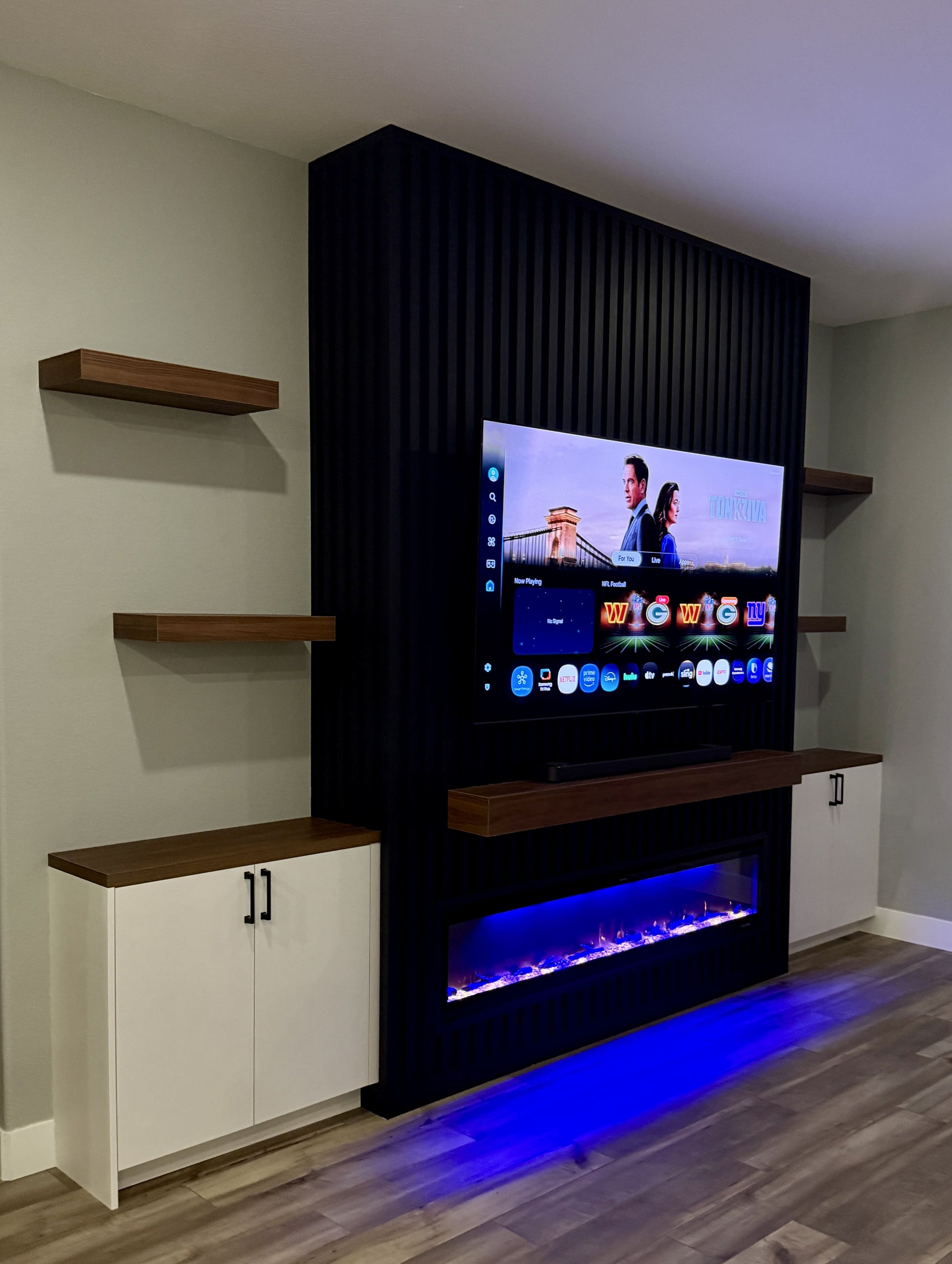 Luxury cabinetry with integrated TV and fireplace