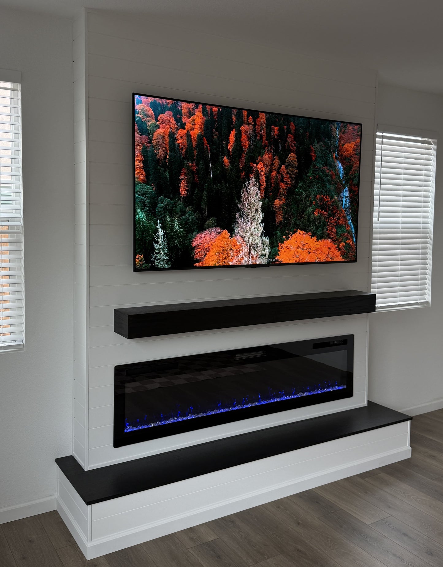 Large television integrated into bespoke media wall design