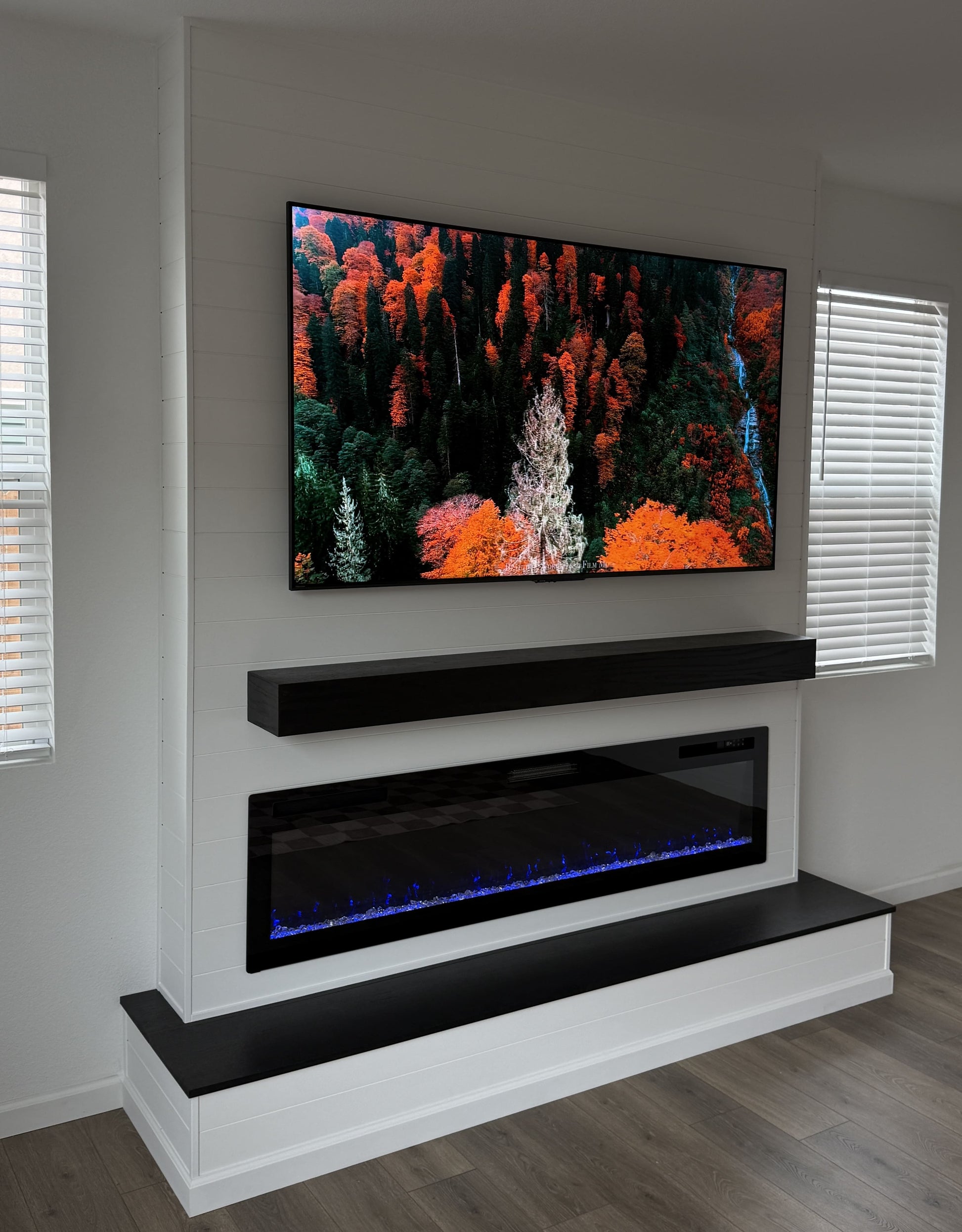 Large television integrated into bespoke media wall design