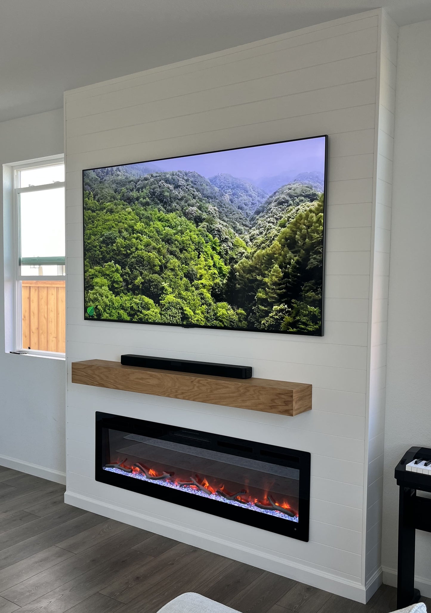 Custom media wall with linear electric fireplace
