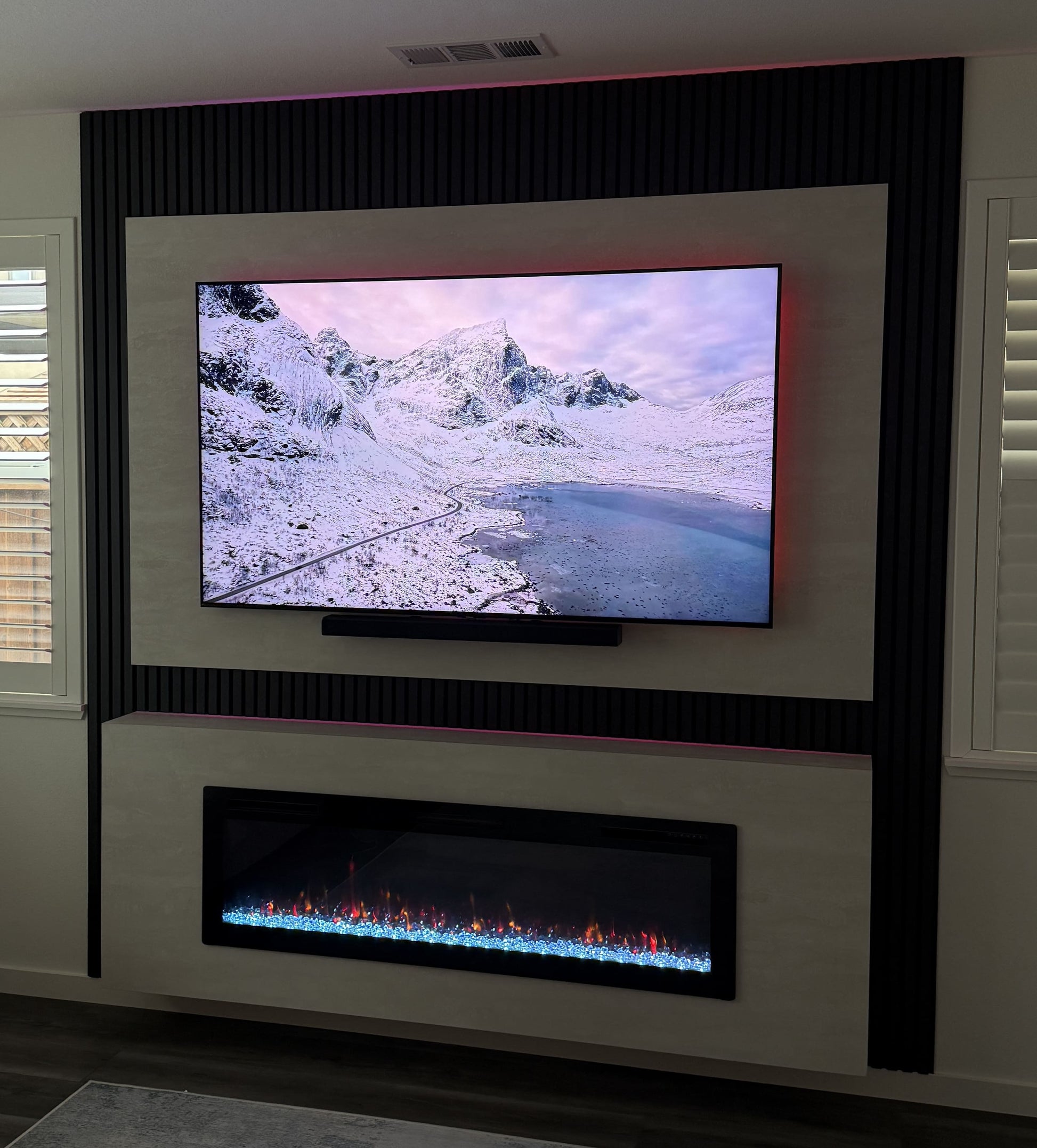 Custom entertainment wall with integrated shelving