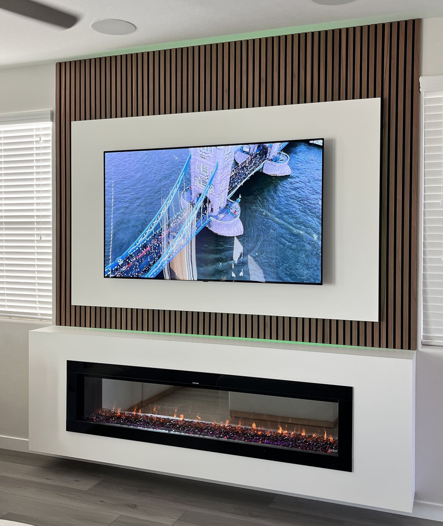 Open-plan living space with custom media wall