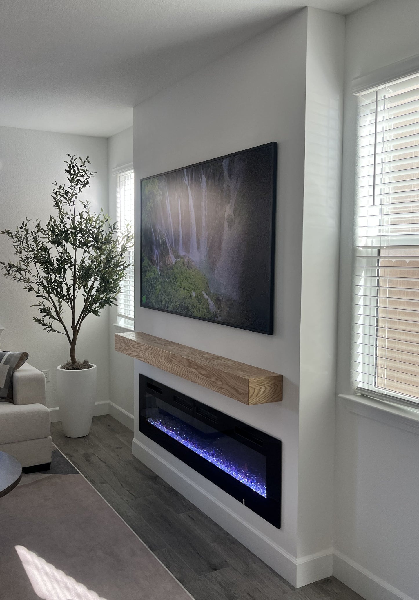 TV wall featuring hidden storage solutions