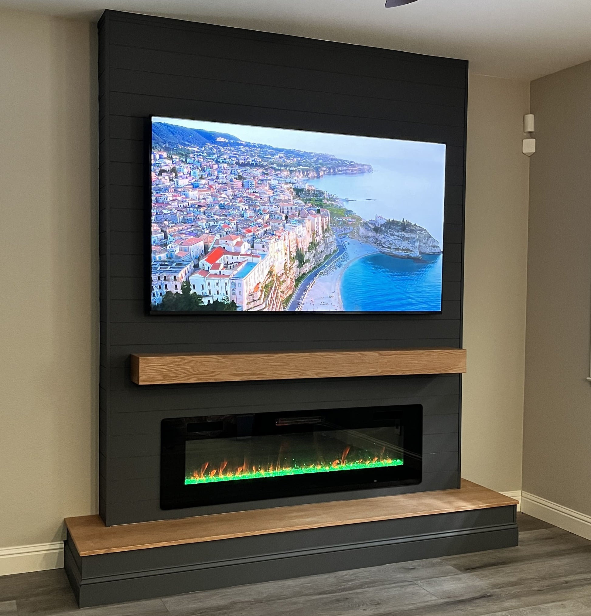 Modern TV wall with built-in fireplace and shelves