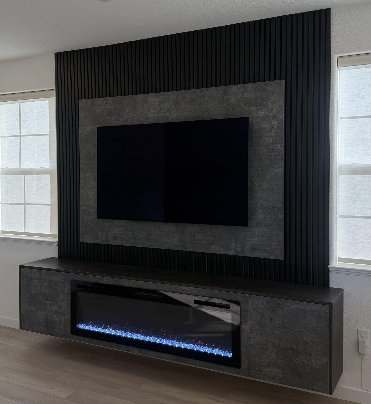 Minimalist living room media wall with LED lighting