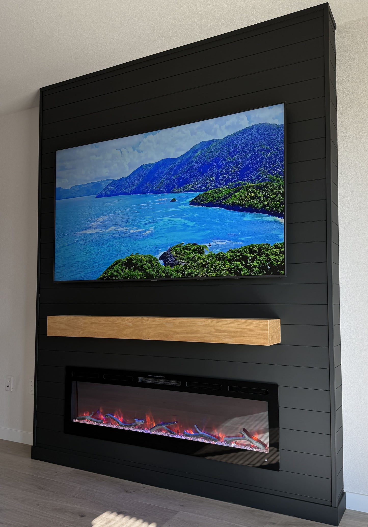 Modern lounge featuring bespoke TV wall unit