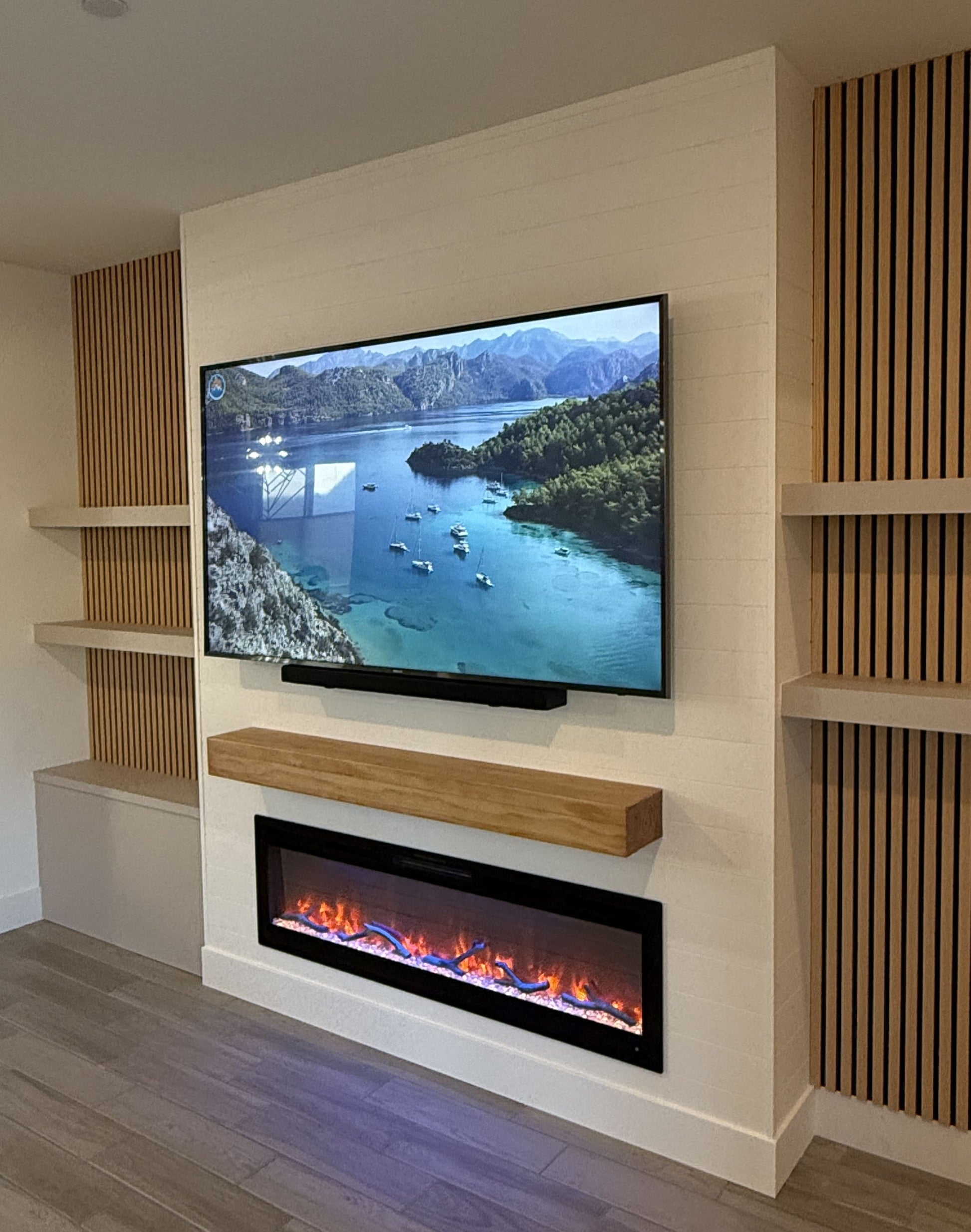 Elegant bespoke cabinets with entertainment wall