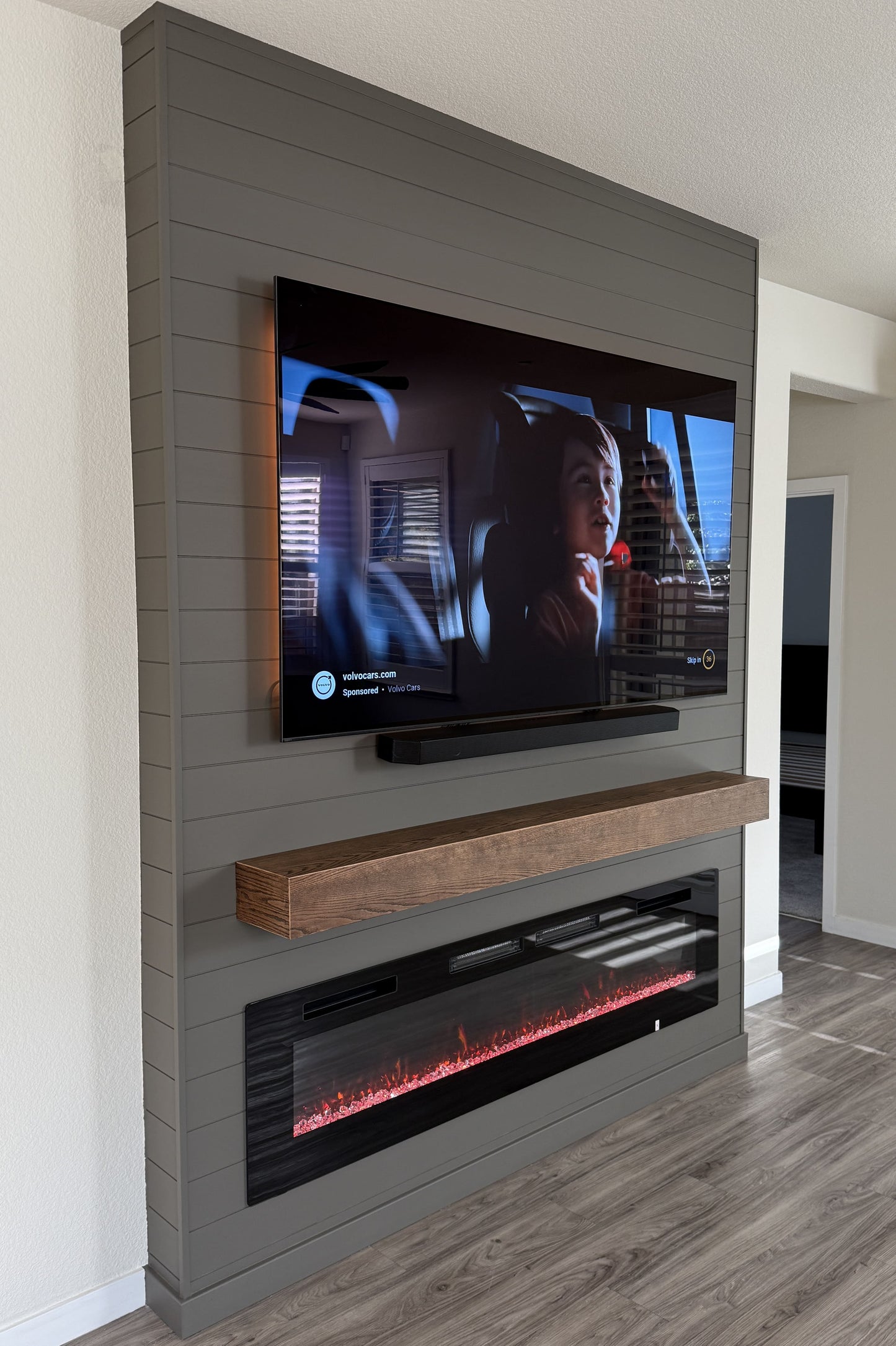 Minimalist living room media wall with LED lighting
