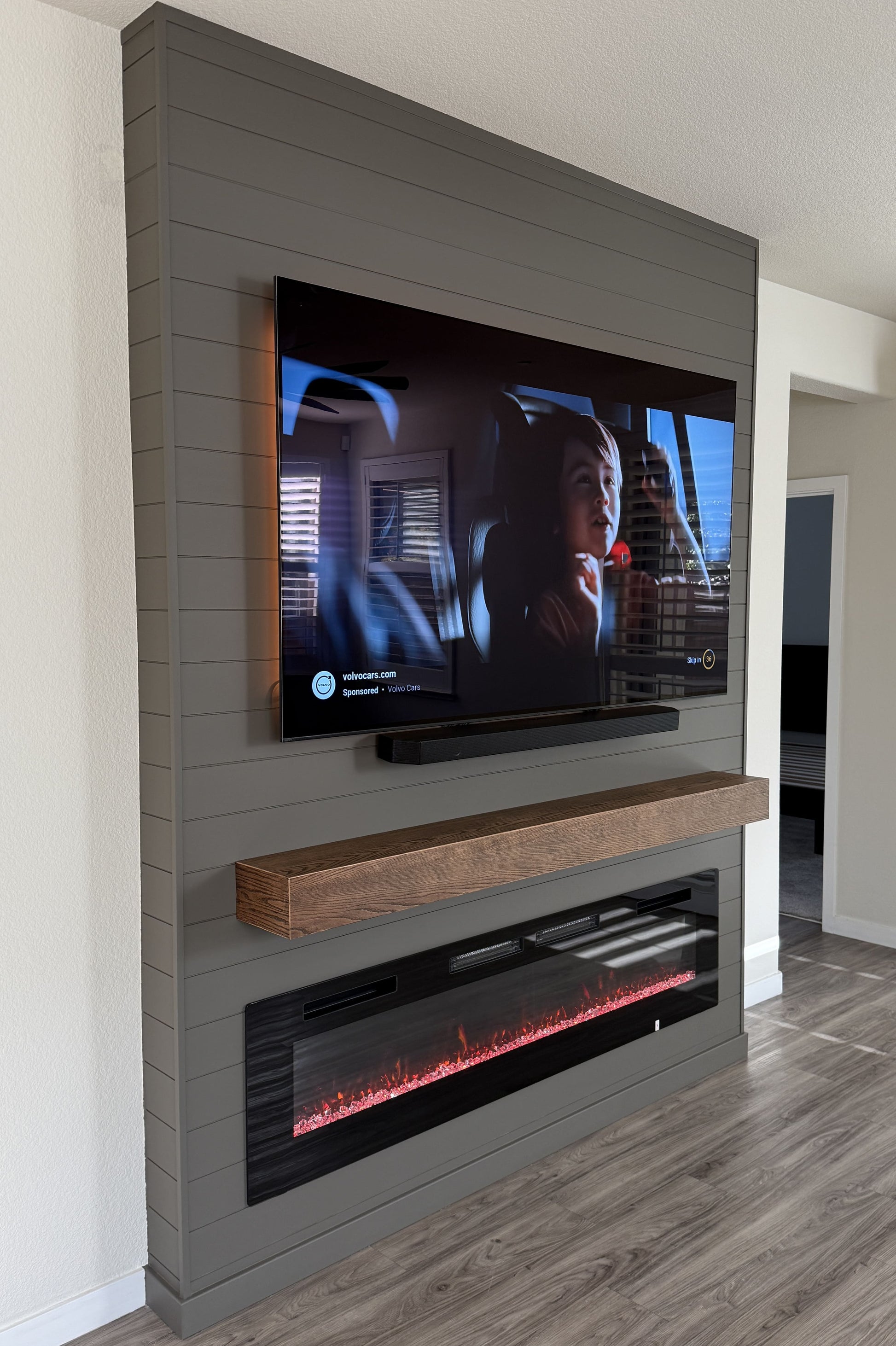 Minimalist living room media wall with LED lighting