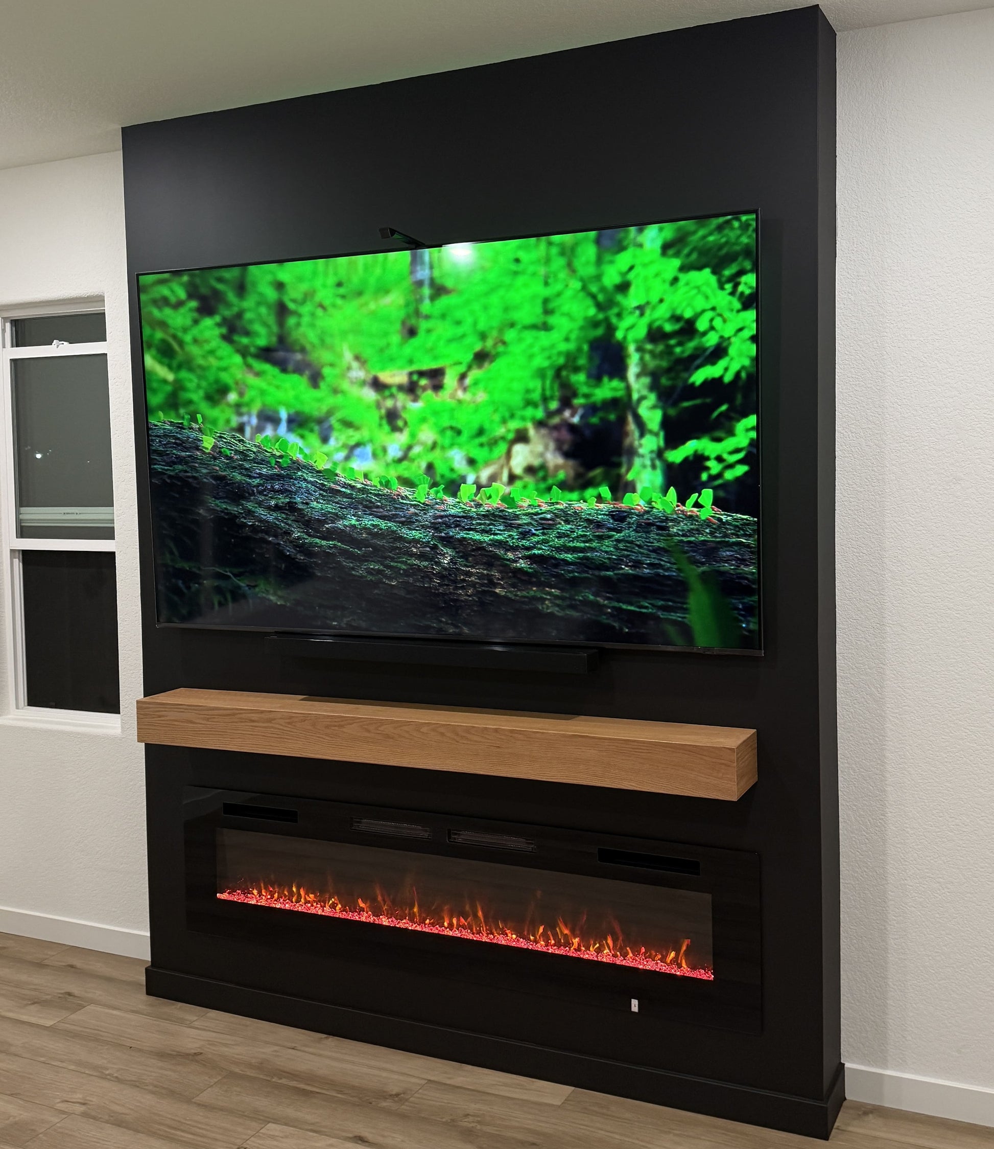 Custom entertainment wall with integrated shelving