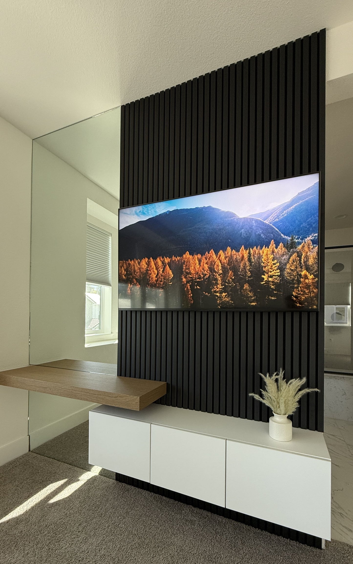 Minimalist media wall with handleless cabinetry