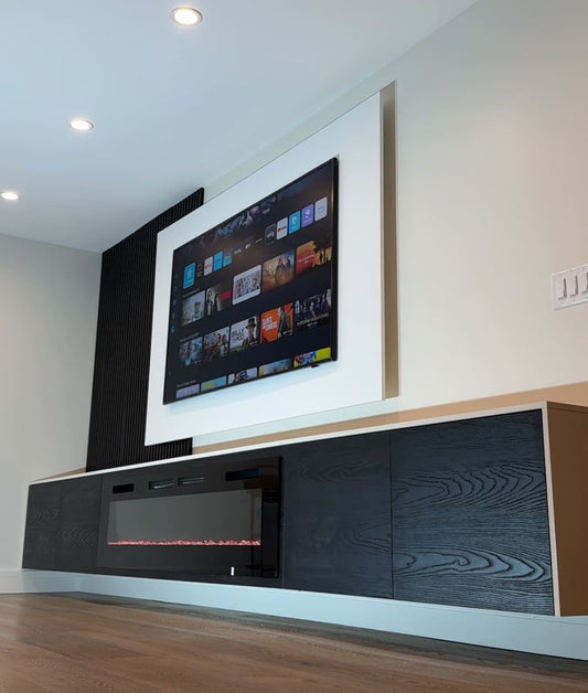 Custom cabinetry with concealed storage and TV unit