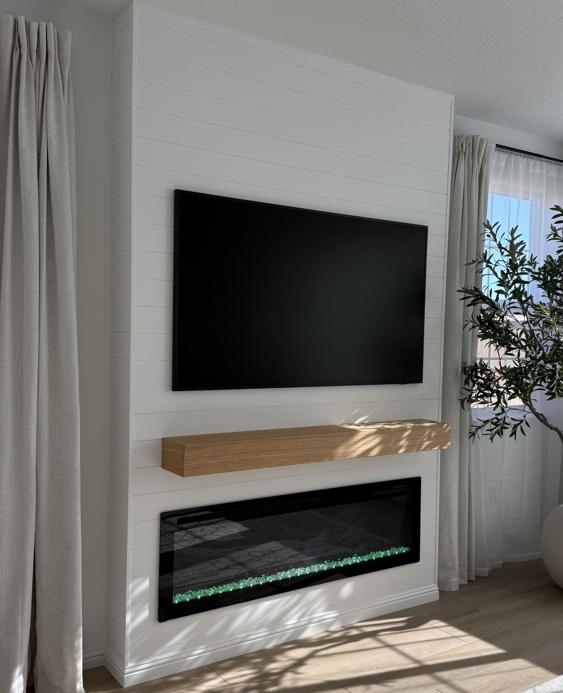 TV wall with recessed LED strip lighting