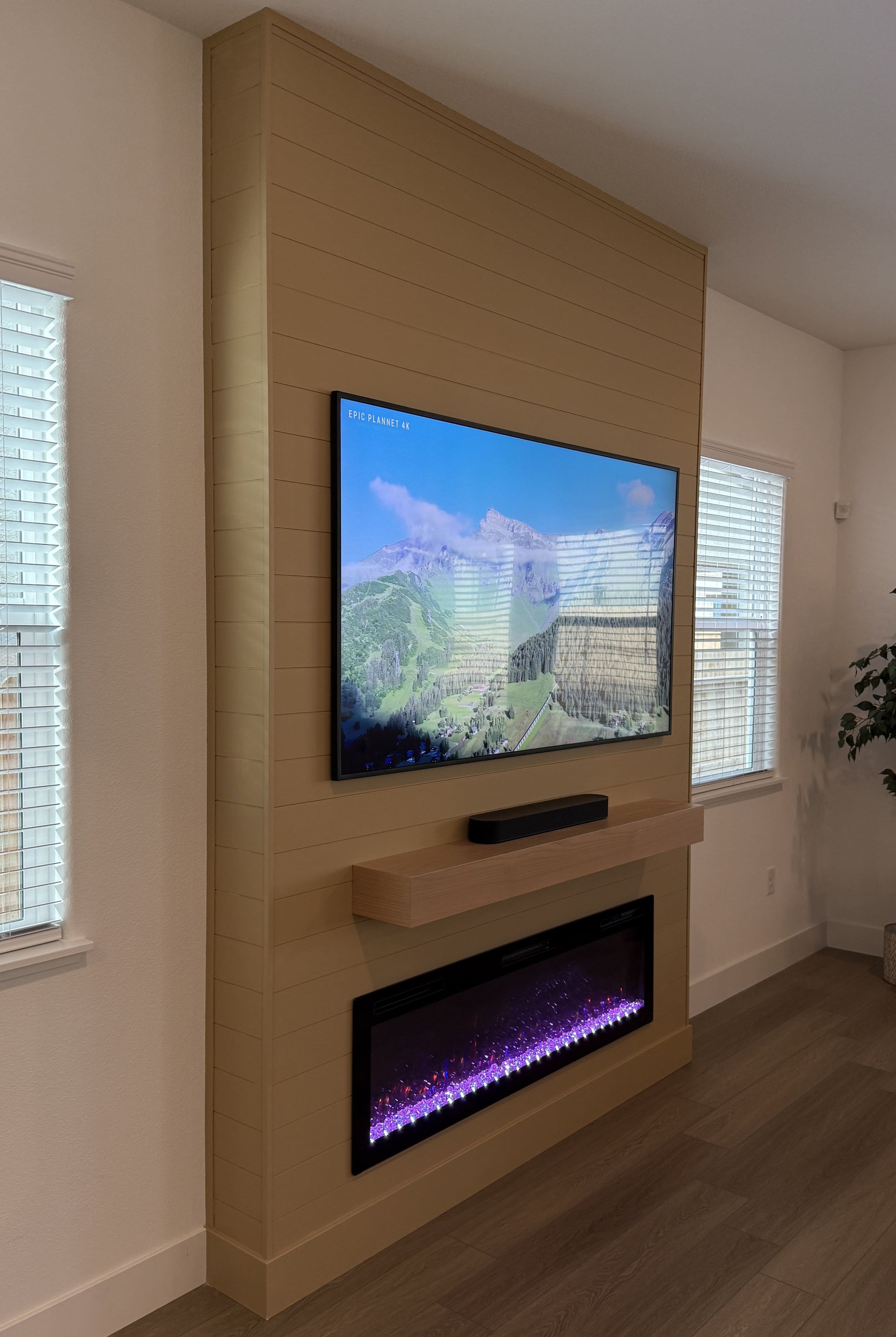 Bespoke entertainment wall with fireplace and shelves