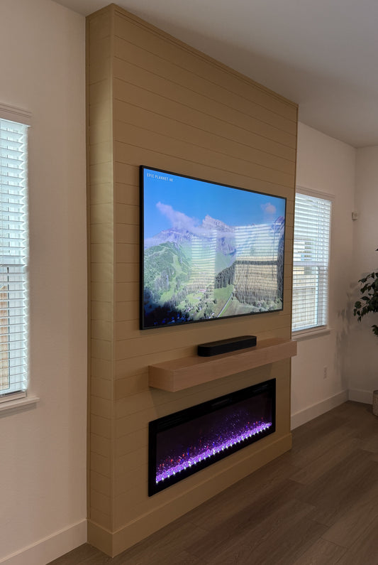 Bespoke entertainment wall with fireplace and shelves
