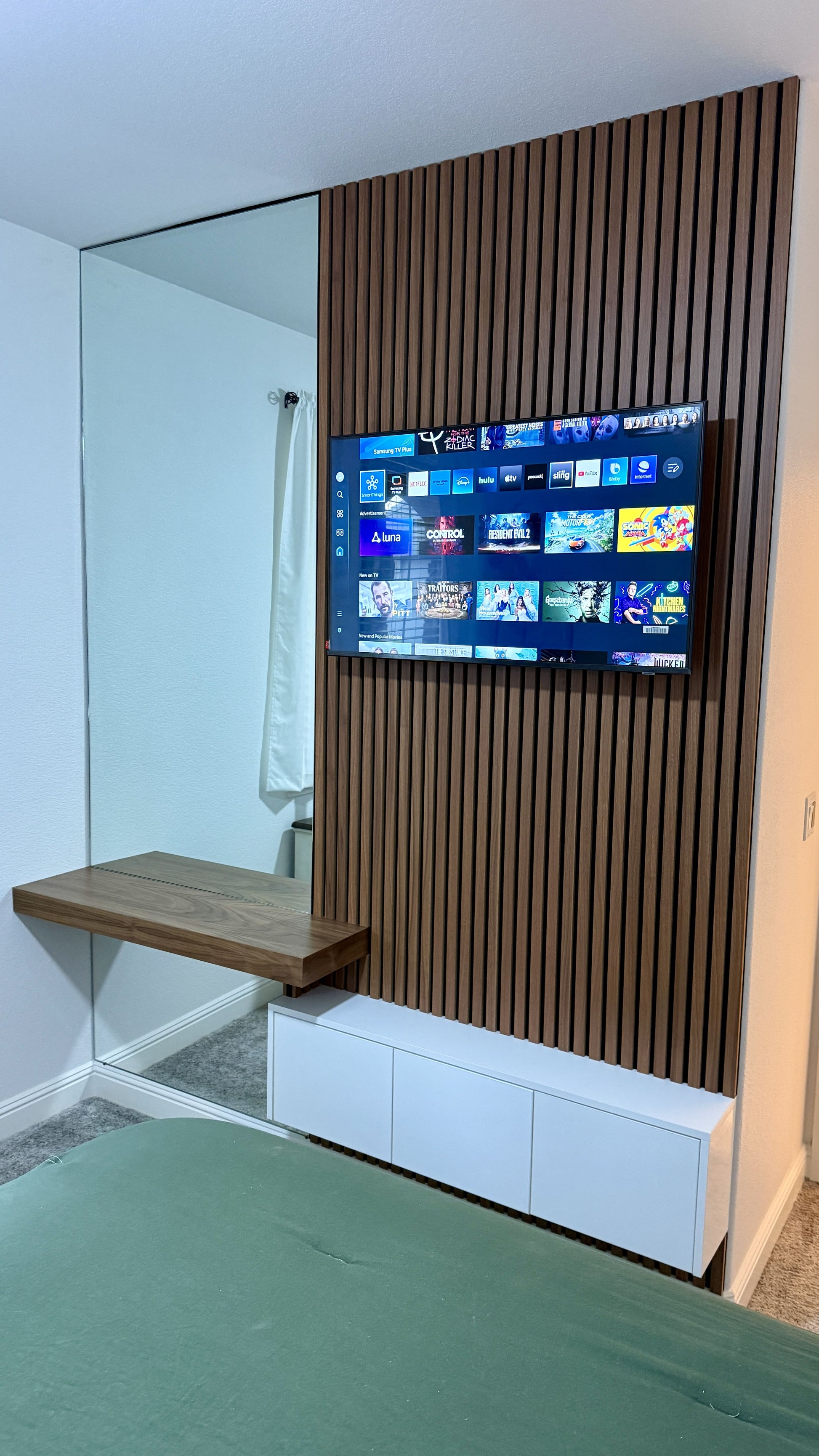 Custom media wall with built-in cabinetry and mounted TV