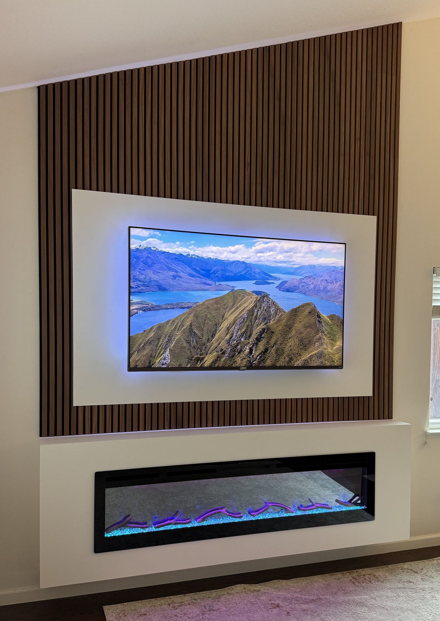 Custom-built media wall with integrated flat-screen TV