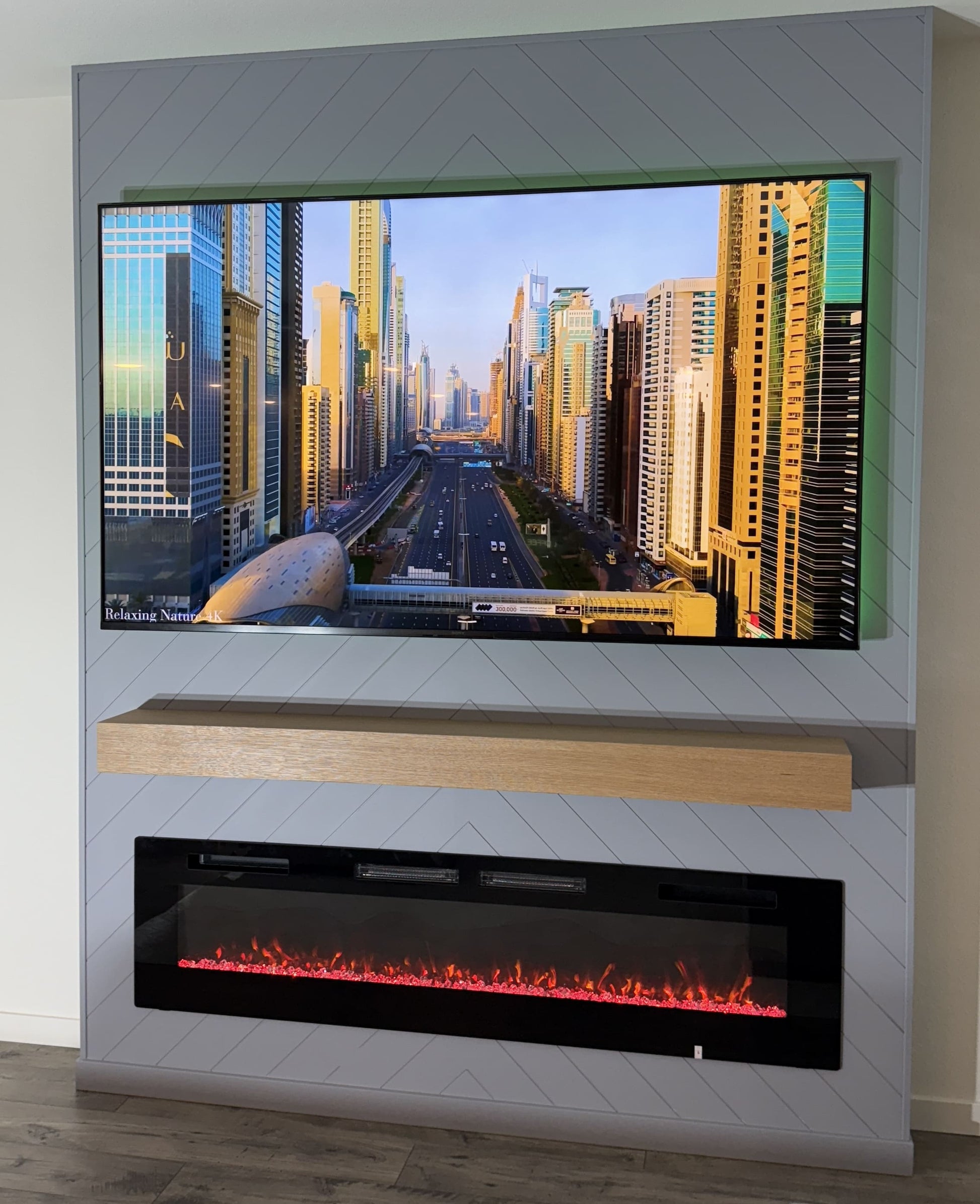 TV wall with natural wood slatted panels