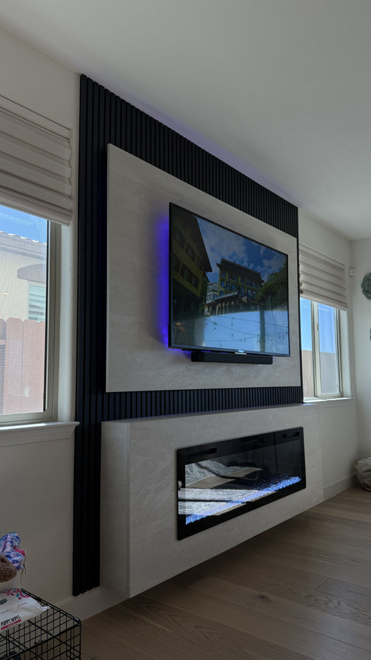 Custom media wall installation with floating cabinets